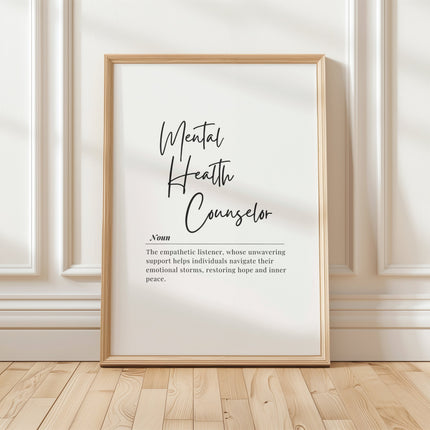 Elegant black script typography displaying 'Mental Health Counselor' with inspirational definition in sans-serif font against clean white background, framed in modern wood for professional therapy spaces.