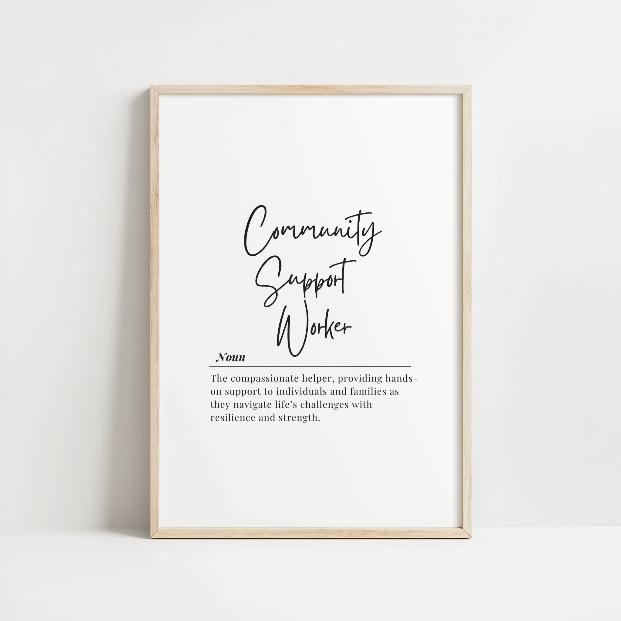 Elegant black typography on a white background featuring the words 'Community Support Worker' in calligraphic font with the professional definition below, creating a minimalist inspirational design for social work office walls.