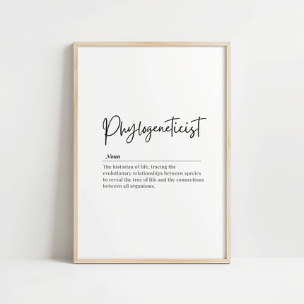 Minimalist black script typography of 'Phylogeneticist' with definition text against clean white background, framed in simple wood, creating an intellectual, focused atmosphere perfect for scientific or academic spaces.