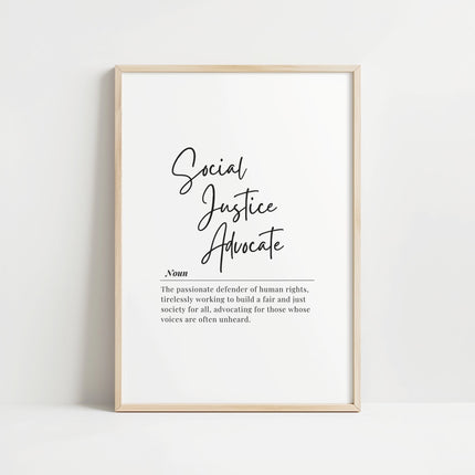 Elegant black typography on white background featuring 'Social Justice Advocate' in script font with serif definition text, framed in understated wood, creating an inspiring and sophisticated advocacy message.