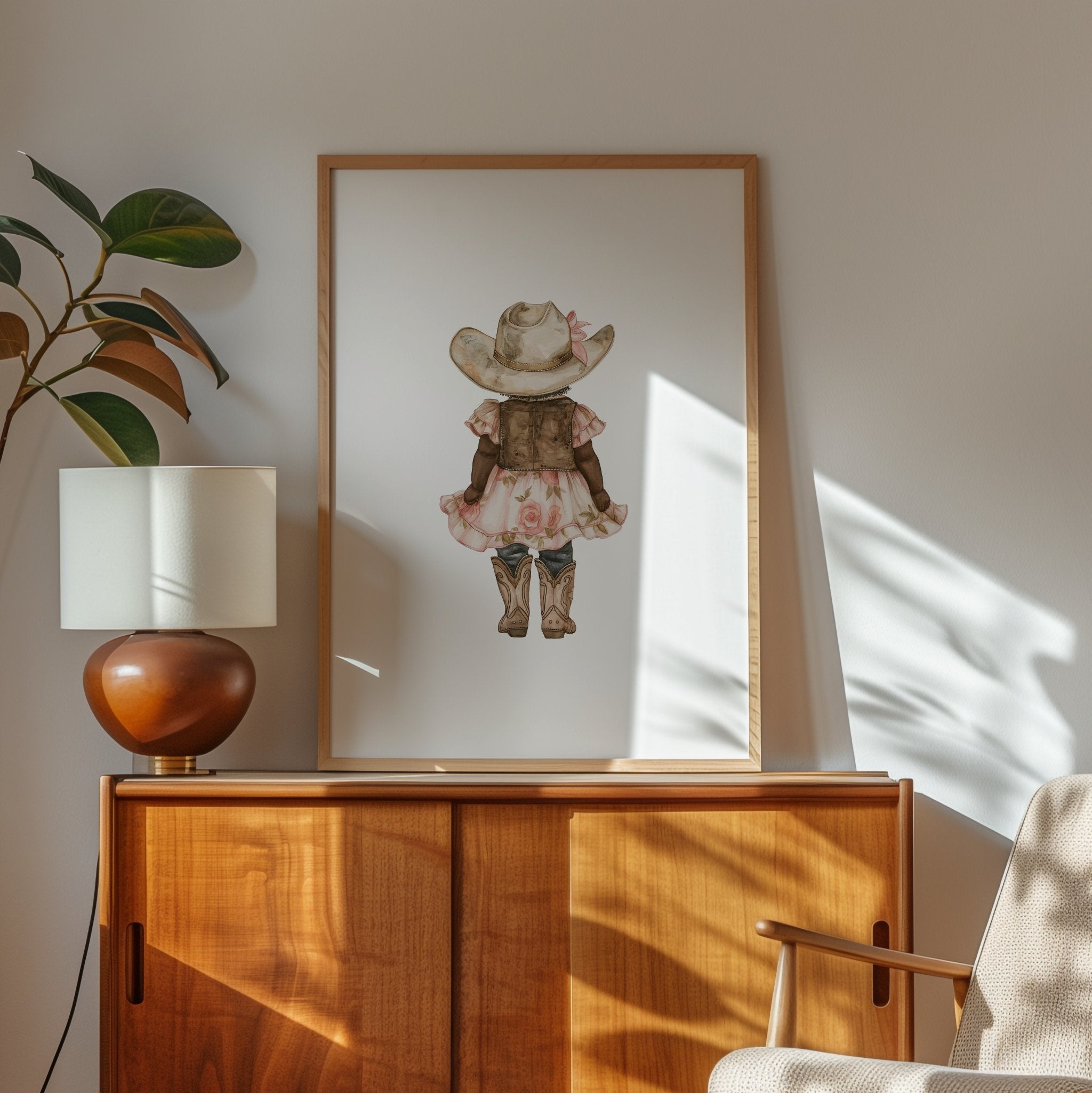 Whimsical illustration of young girl wearing cowboy hat, pink floral dress and boots against white background, creating a soft botanical aesthetic perfect for nursery or children's room decor.