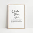 Elegant black and white typography print featuring 'Domestic Violence Advocate' in bold script with supportive definition in serif font against clean white background, framed in natural wood.