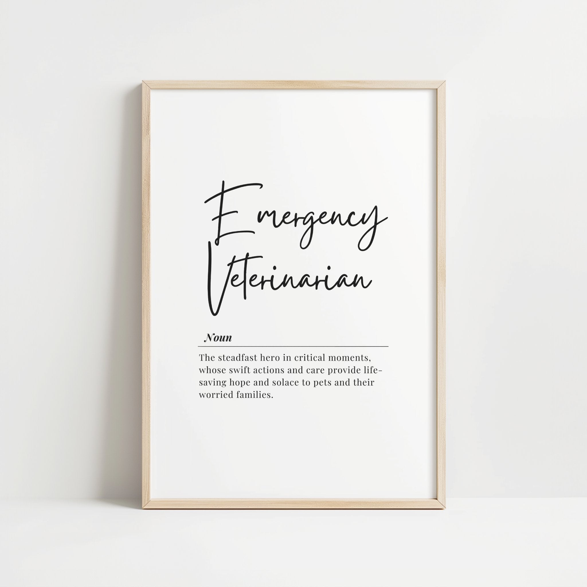 Black script 'Emergency Veterinarian' definition print on white background featuring elegant typography and inspirational quote about veterinarians being steadfast heroes providing hope to pets and families.