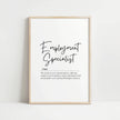 Black and white minimalist typography featuring 'Employment Specialist' in elegant script and serif fonts, with an inspiring professional definition against clean white background in modern wood frame.