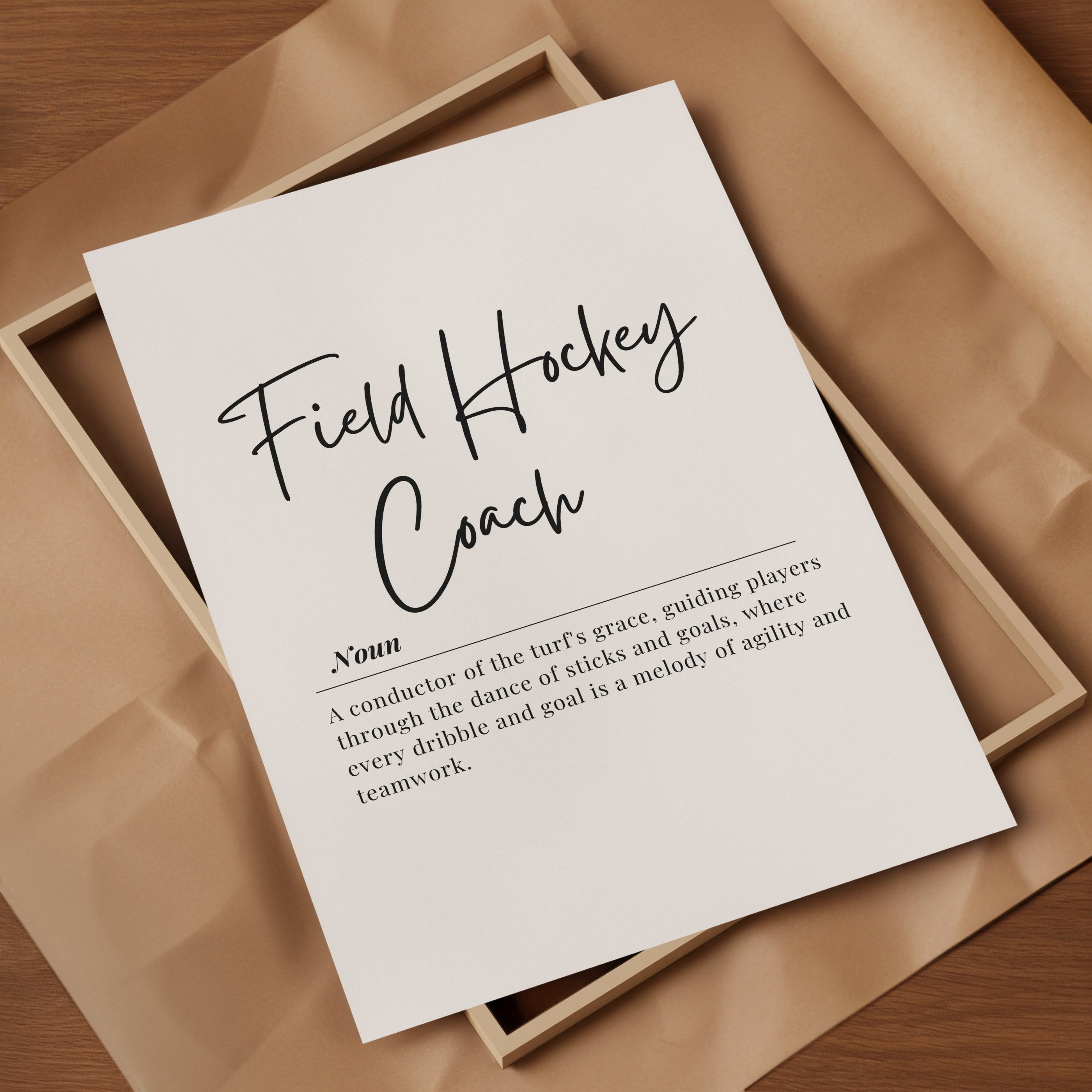 Elegant field hockey coach definition typography print featuring black script and serif fonts on white background, blending motivational quote with minimalist design for professional sports environments.