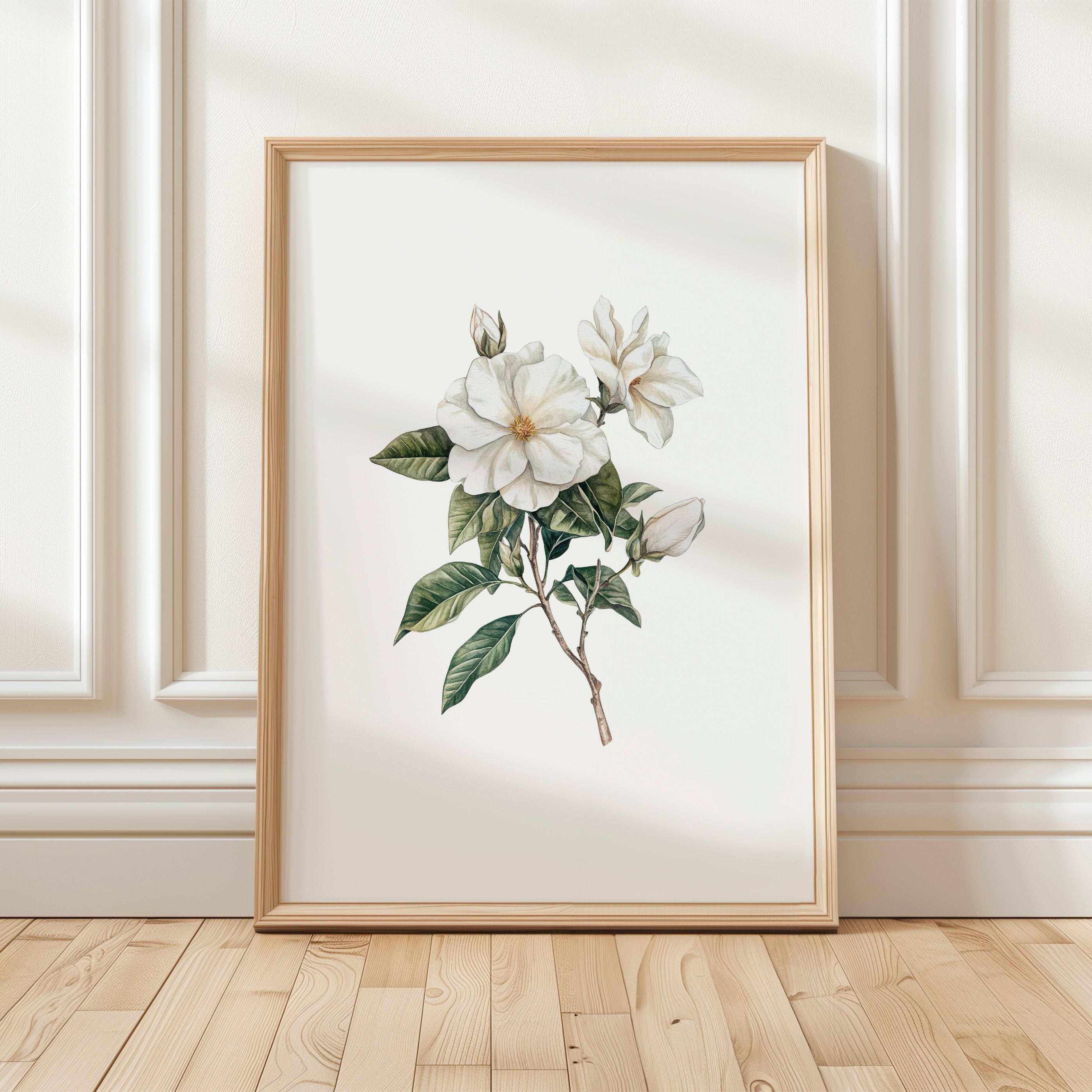 Delicate white magnolia branch with lush green leaves on crisp white background, creating a serene botanical illustration with vintage elegance perfect for traditional or rustic spaces.