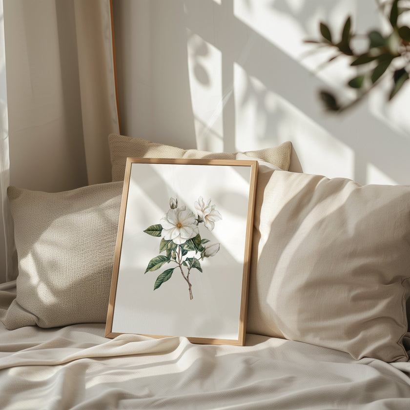Delicate white magnolia branch with lush green leaves on crisp white background, creating a serene botanical illustration with vintage elegance perfect for traditional or rustic spaces.