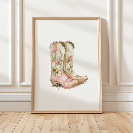 Delicate watercolor cowboy boots adorned with soft pink and sage green florals against a clean white background, creating a feminine country-inspired art piece with vintage charm.