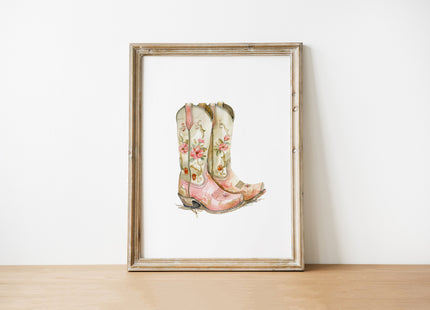 Delicate watercolor cowboy boots adorned with soft pink and sage green florals against a clean white background, creating a feminine country-inspired art piece with vintage charm.