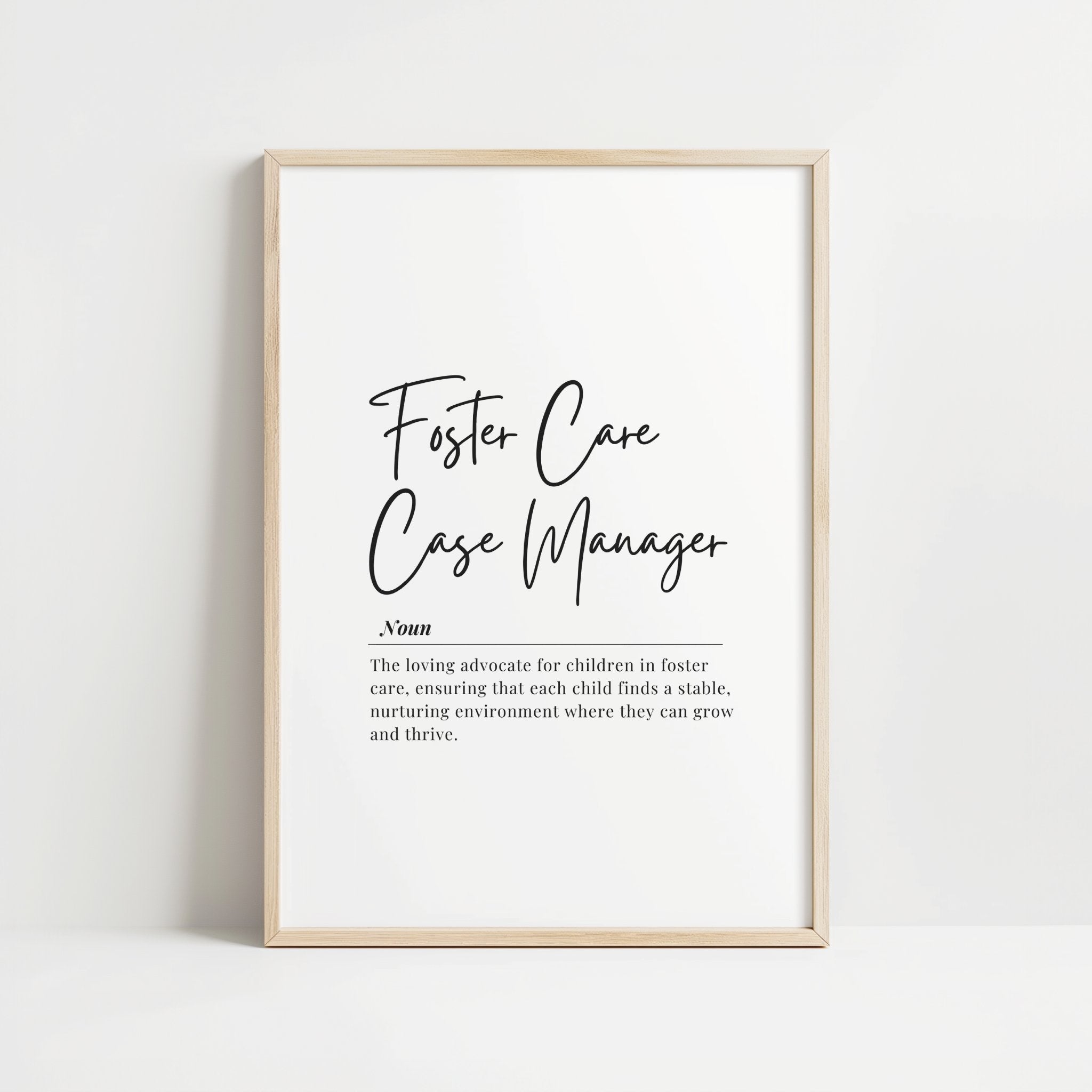 Black typographical definition print against white background displaying 'Foster Care Case Manager' with inspirational description, framed in wood, perfect for professional office settings.