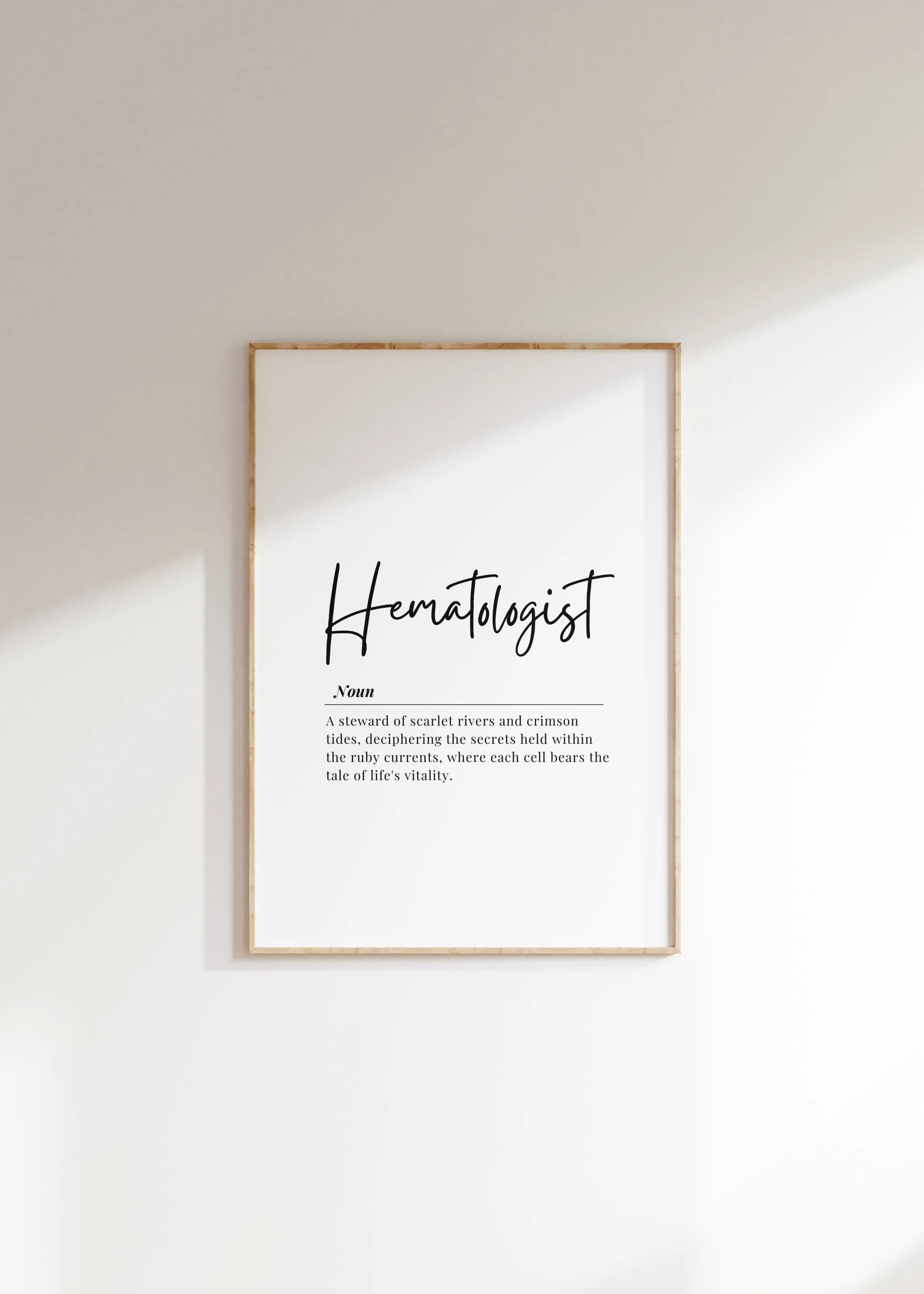 Elegant monochrome typography print featuring 'Hematologist' in bold script font with a poetic definition below, creating a sophisticated and inspirational piece for medical offices.
