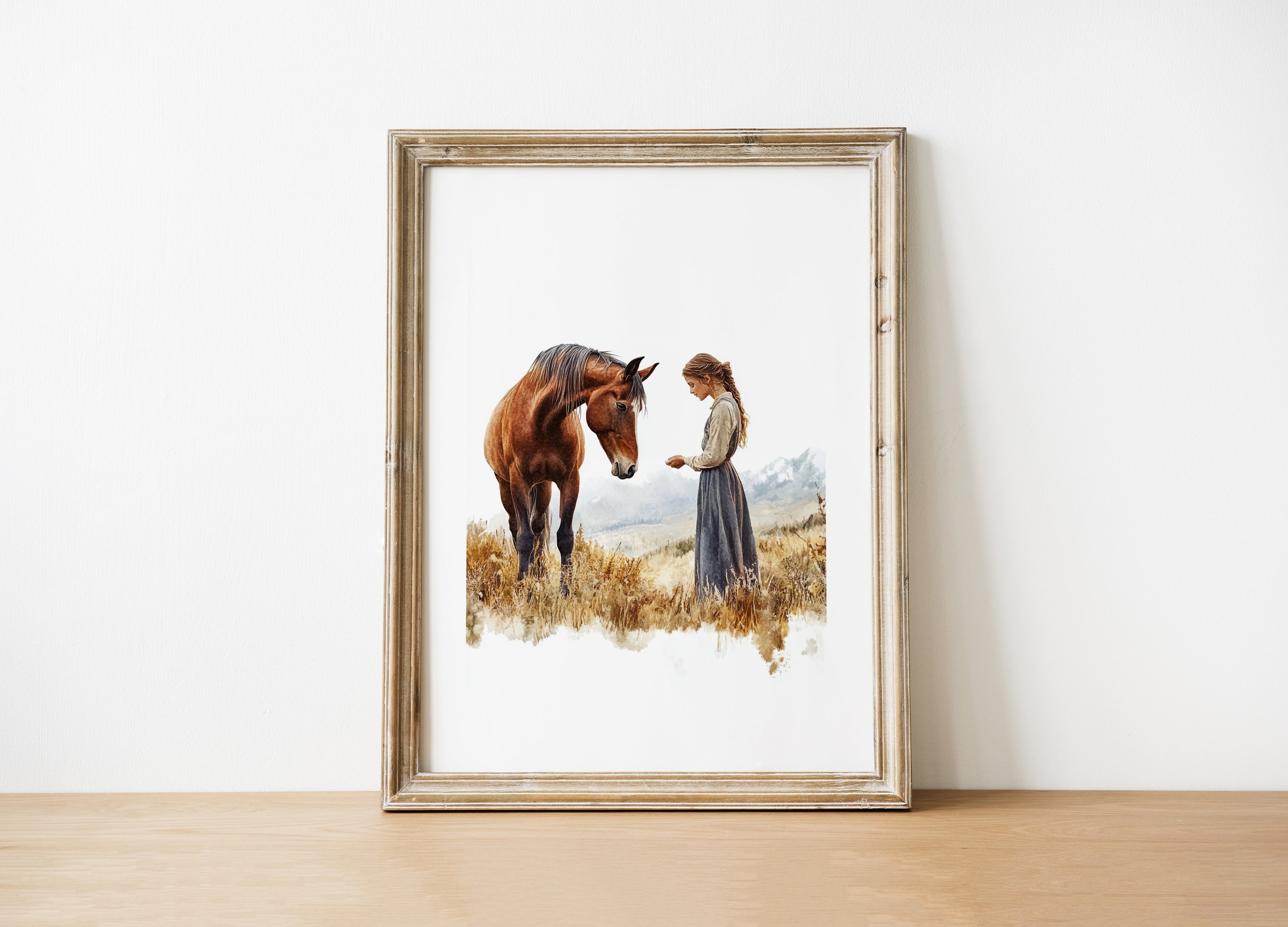 Serene vintage print of girl with horse in warm earth tones and sage greens, showcasing gentle interaction against white background with rustic wooden frame for farmhouse living spaces.