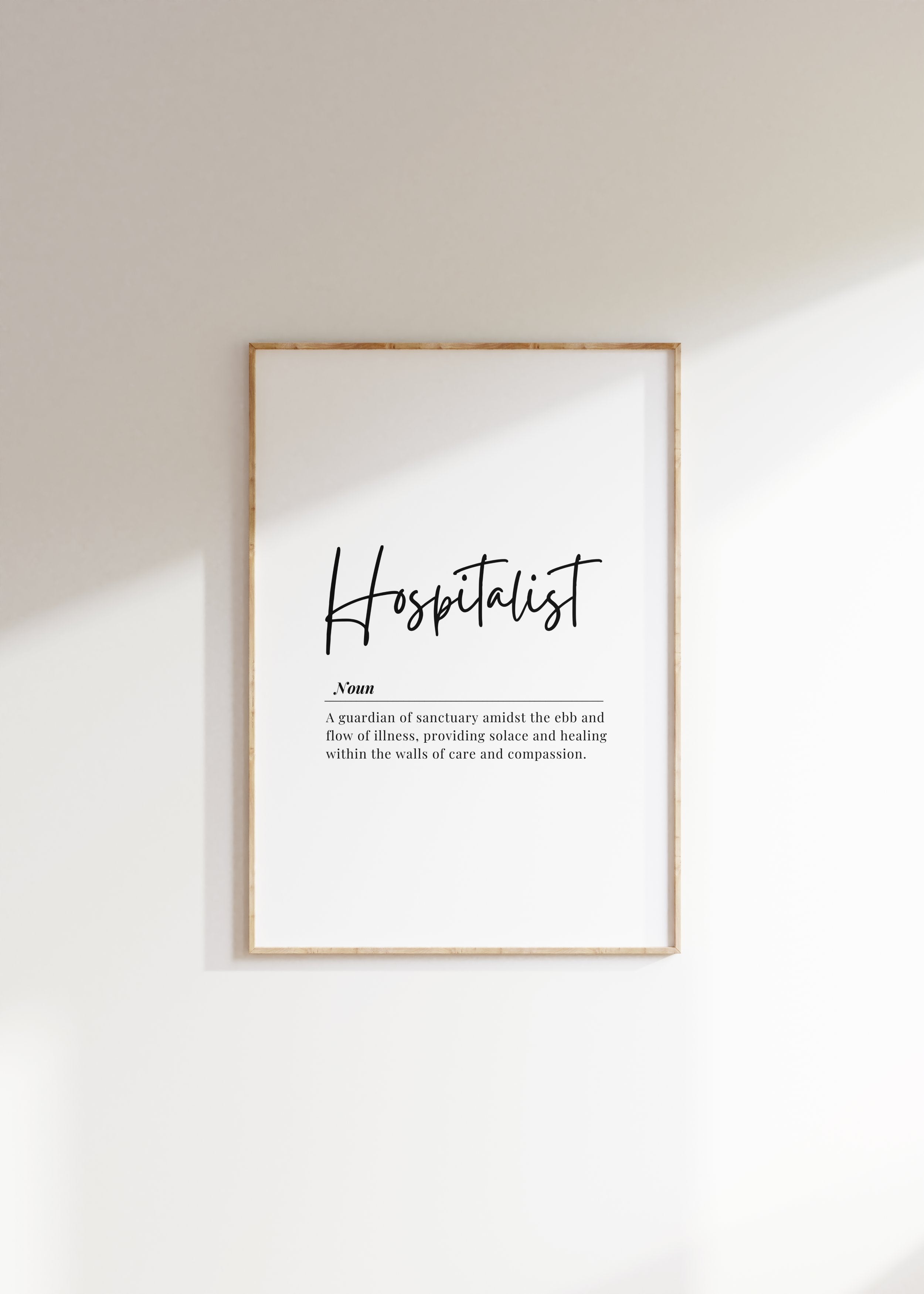 Minimalist typographic design featuring 'Hospitalist' in bold script against a white background with an elegant definition below, framed in natural wood for a calming professional environment.