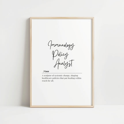 Monochrome typography print featuring 'Immunology Policy Analyst' definition with elegant script and serif fonts against white background, framed in sleek wood for professional healthcare settings.