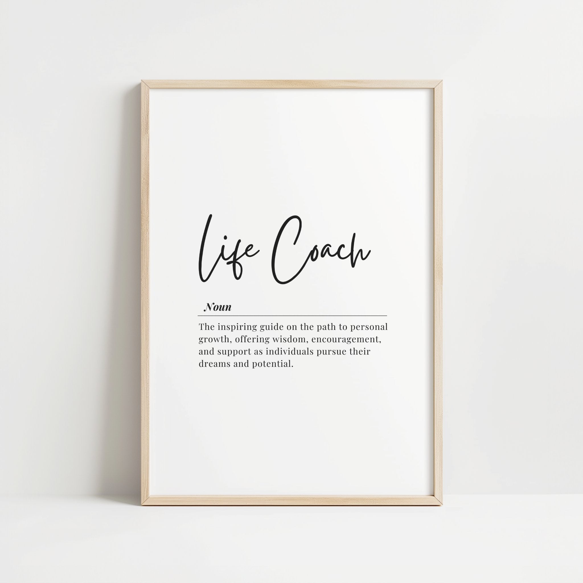 Minimalist black and white typography print featuring 'Life Coach' in elegant script and its definition in serif font against a clean white background, perfect for inspiring professional spaces.