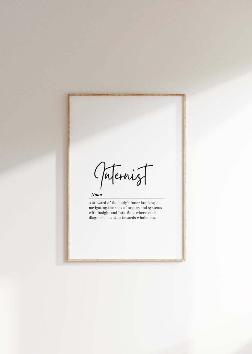 Minimalist typography print featuring 'Internist' in bold sans-serif font with an elegant definition beneath on white background with wood frame, creating a sophisticated professional aesthetic.