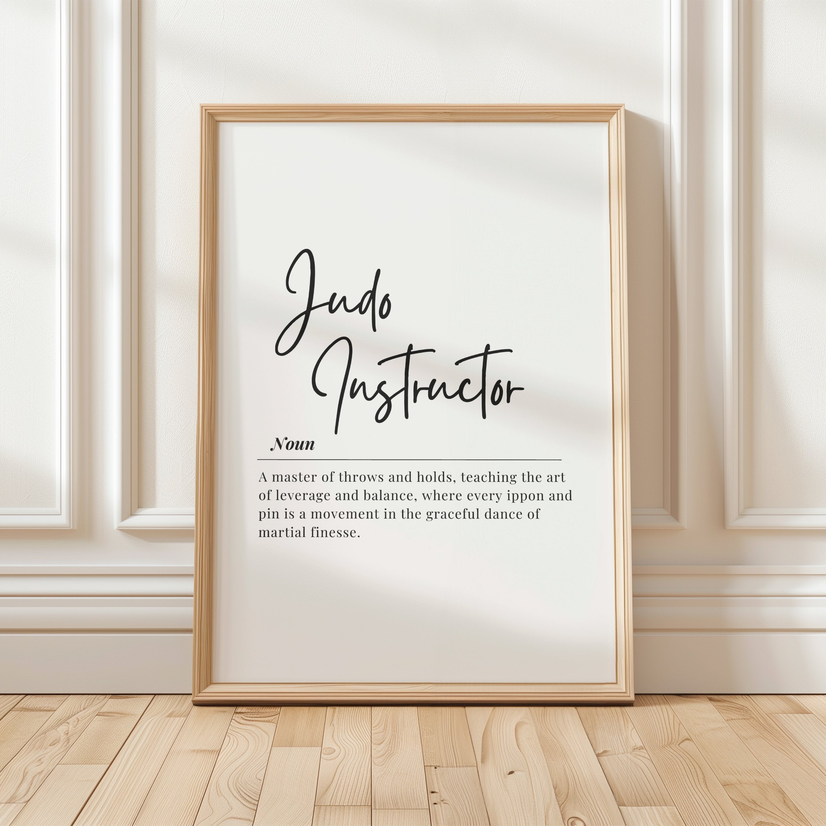 Minimalist typography wall art with 'Judo Instructor' in elegant black script on white background, featuring a definition about mastery of throws and holds, balance, and martial finesse.