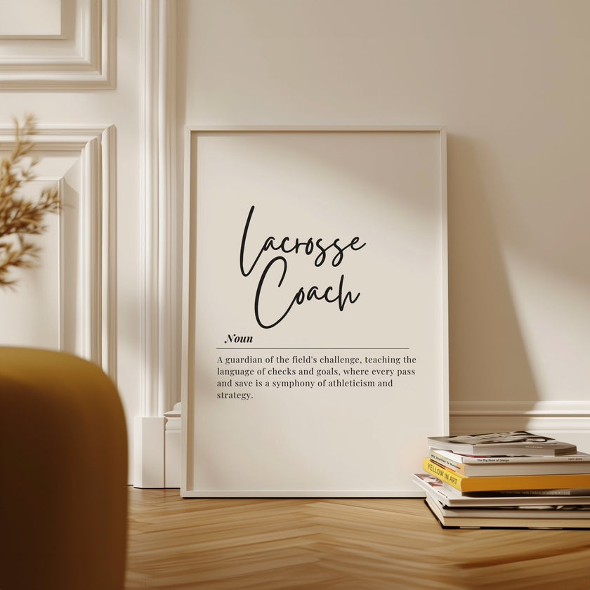 Minimalist black script typography displaying 'Lacrosse Coach' definition against white background, framed in natural wood, perfect for athletic environments and modern office spaces.