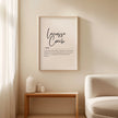 Minimalist black script typography displaying 'Lacrosse Coach' definition against white background, framed in natural wood, perfect for athletic environments and modern office spaces.