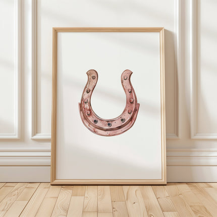 Minimalist copper horseshoe against white background in rustic frame, conveying warmth and protection through simple, elegant design perfect for farmhouse or Scandinavian decor.