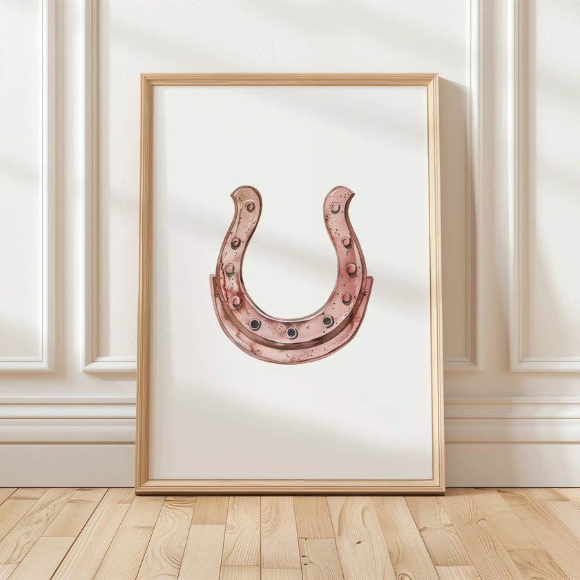 Minimalist copper horseshoe against white background in rustic frame, conveying warmth and protection through simple, elegant design perfect for farmhouse or Scandinavian decor.