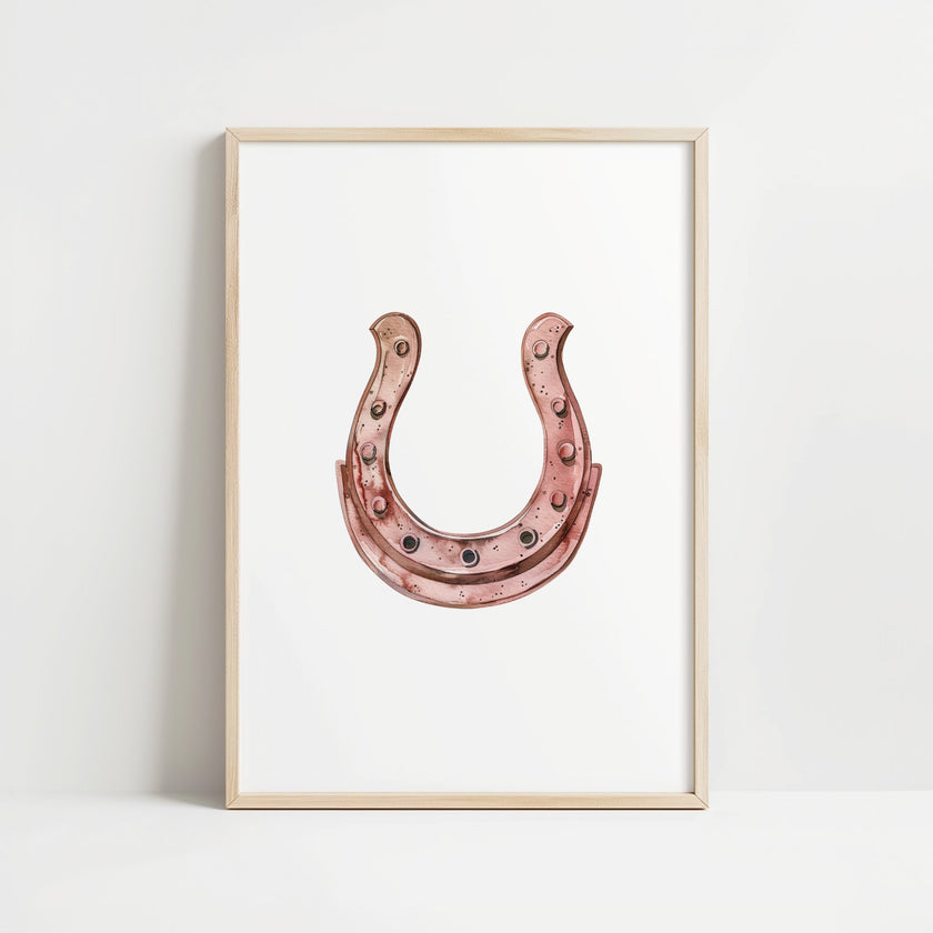 Minimalist copper horseshoe against white background in rustic frame, conveying warmth and protection through simple, elegant design perfect for farmhouse or Scandinavian decor.