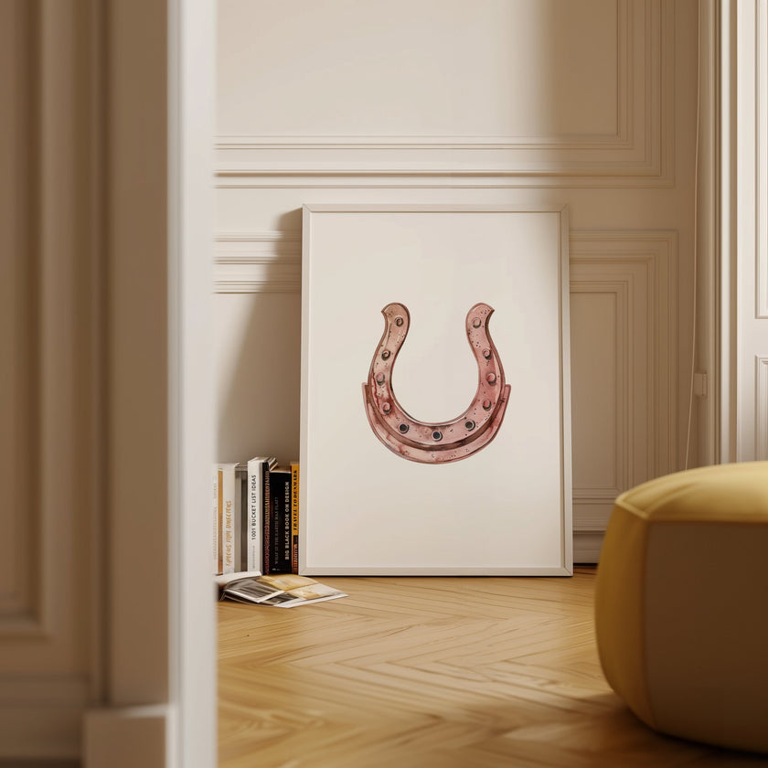 Minimalist copper horseshoe against white background in rustic frame, conveying warmth and protection through simple, elegant design perfect for farmhouse or Scandinavian decor.