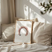 Minimalist vintage horseshoe print in warm copper tones against crisp white background, featuring rustic texturing and simple composition perfect for farmhouse and Scandinavian decor