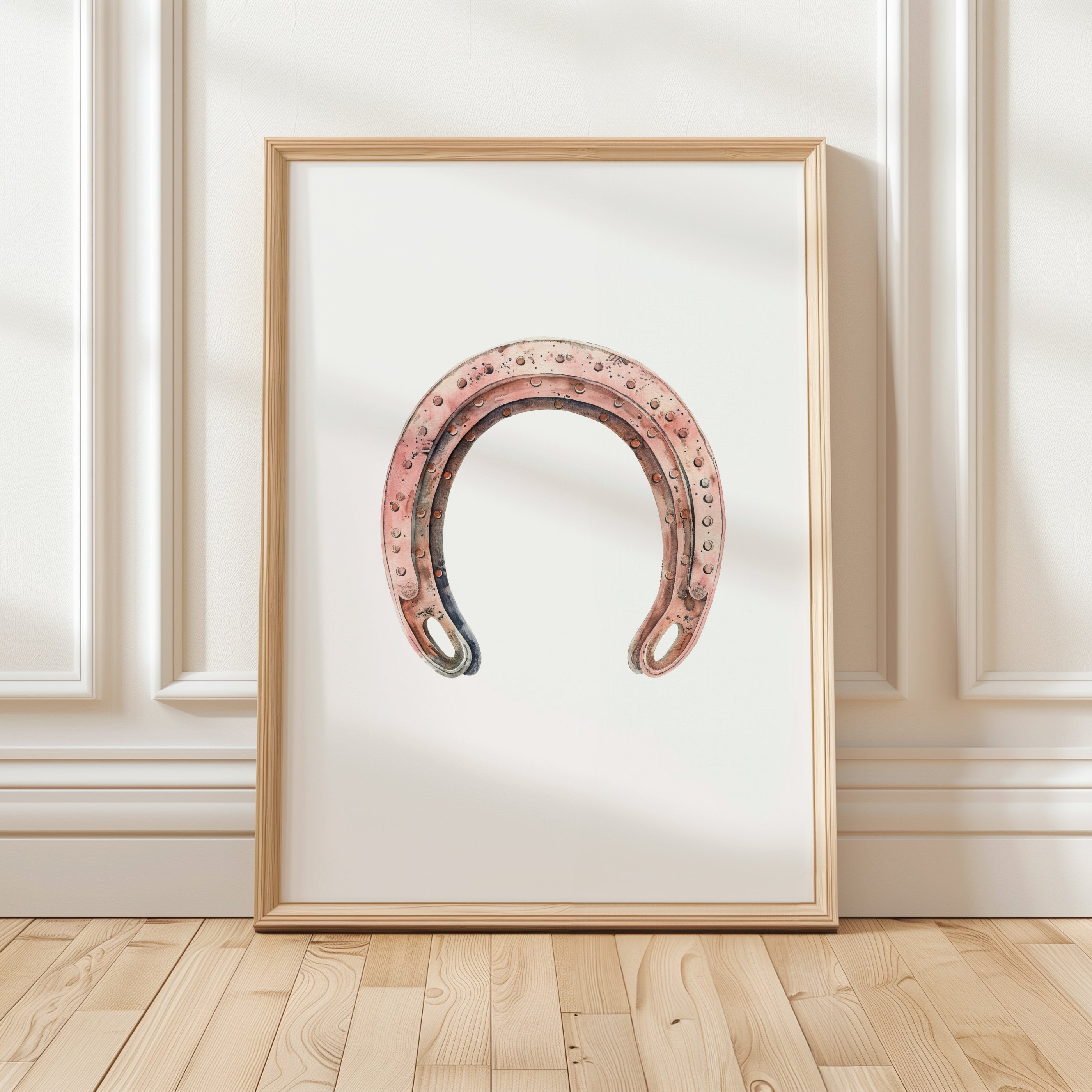 Minimalist vintage horseshoe print in warm copper tones against crisp white background, featuring rustic texturing and simple composition perfect for farmhouse and Scandinavian decor