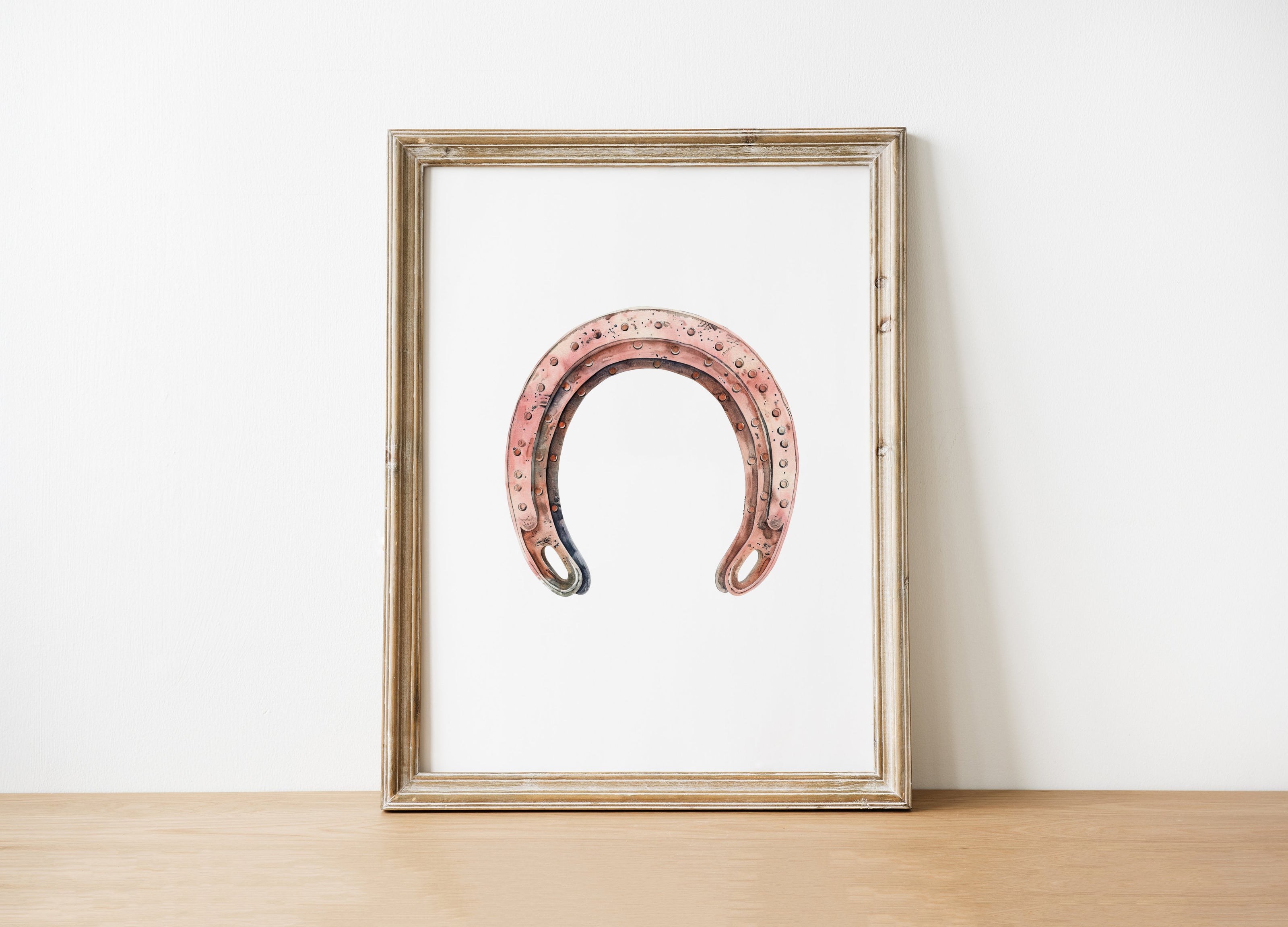 Minimalist vintage horseshoe print in warm copper tones against crisp white background, featuring rustic texturing and simple composition perfect for farmhouse and Scandinavian decor