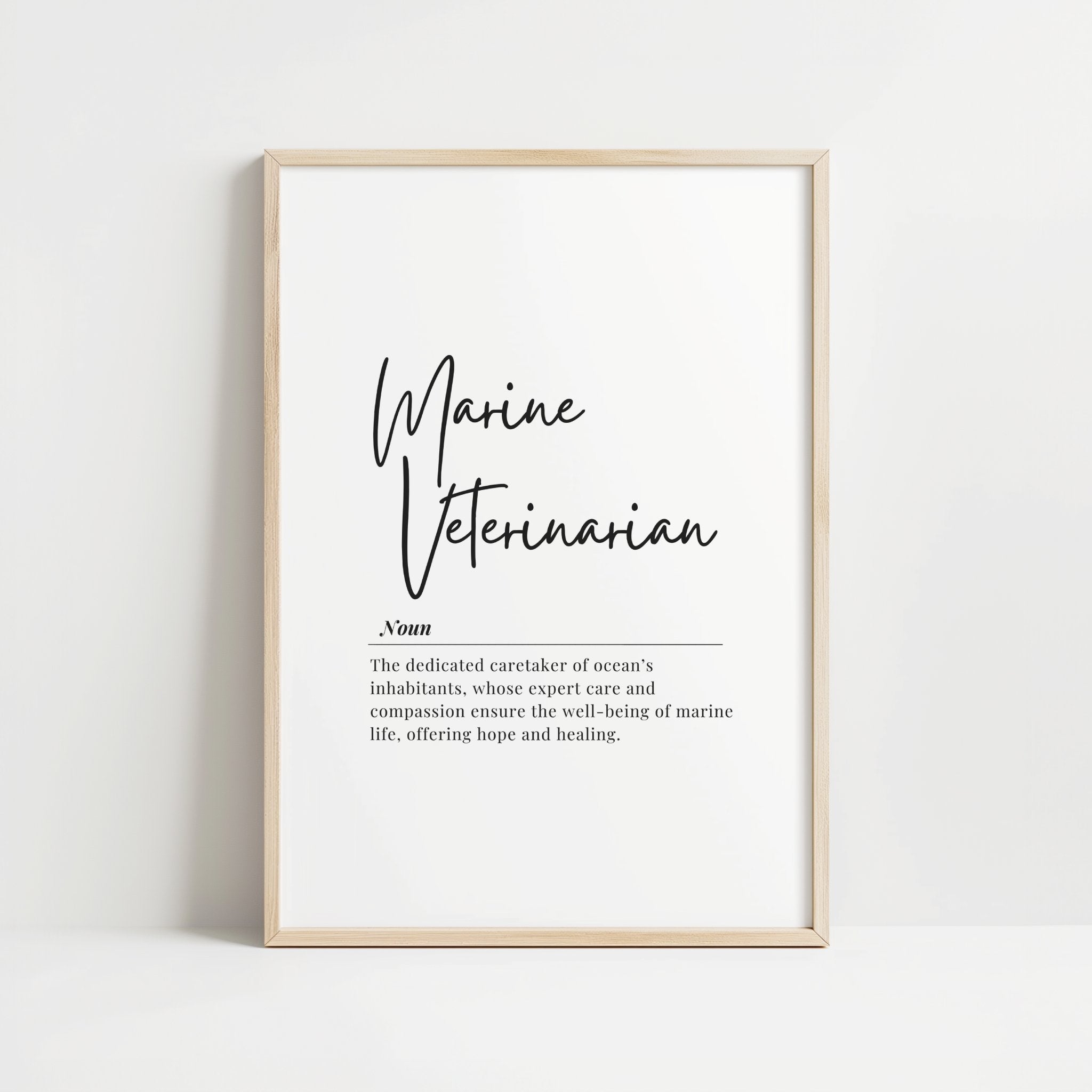 Minimalist Marine Veterinarian definition print with sleek script font on white background, combining professional serif typography and elegant wooden frame, perfect for modern offices and educational spaces.