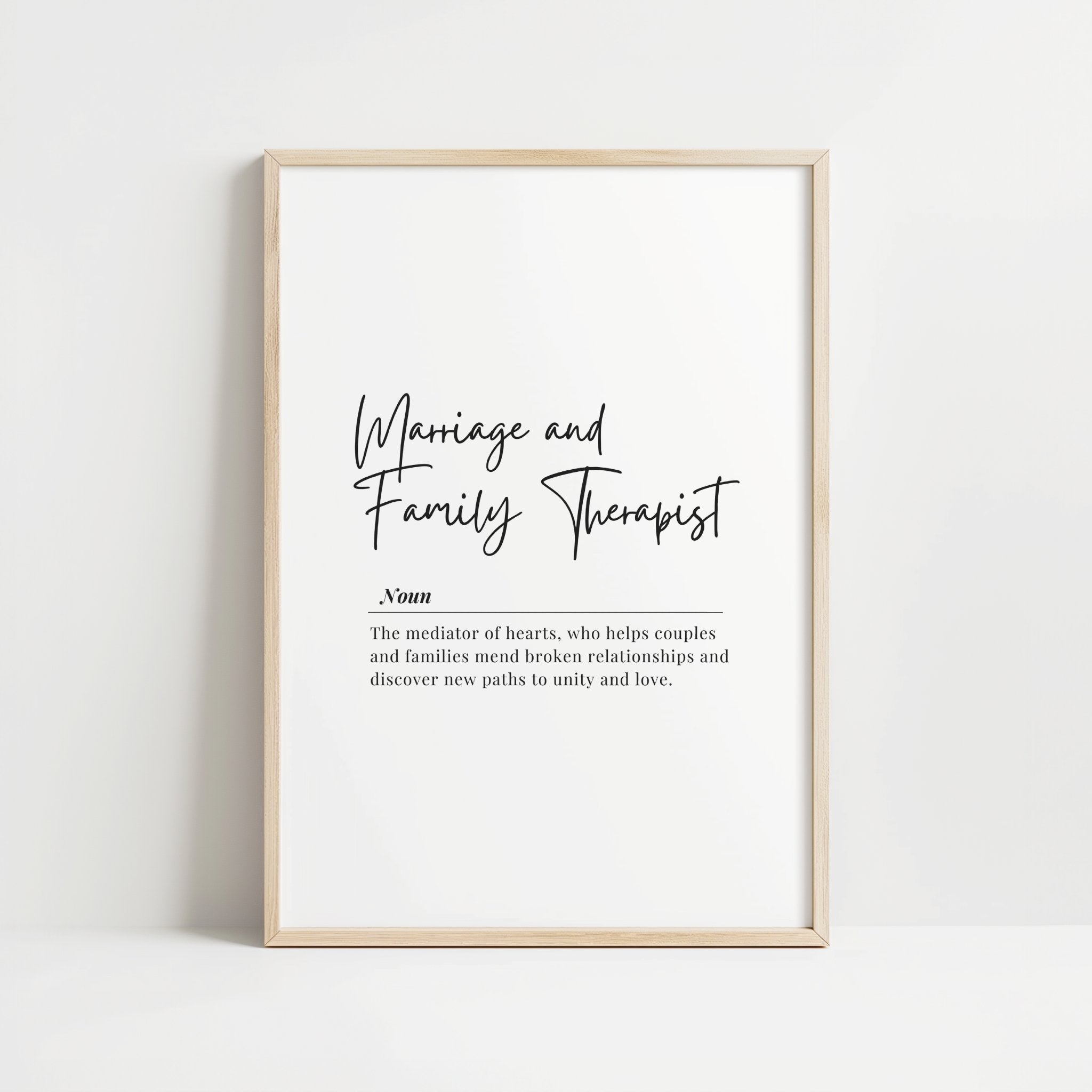Minimalist black and white typography print featuring 'Marriage and Family Therapist' in elegant script font with definition below, creating a sophisticated and calming professional art piece.
