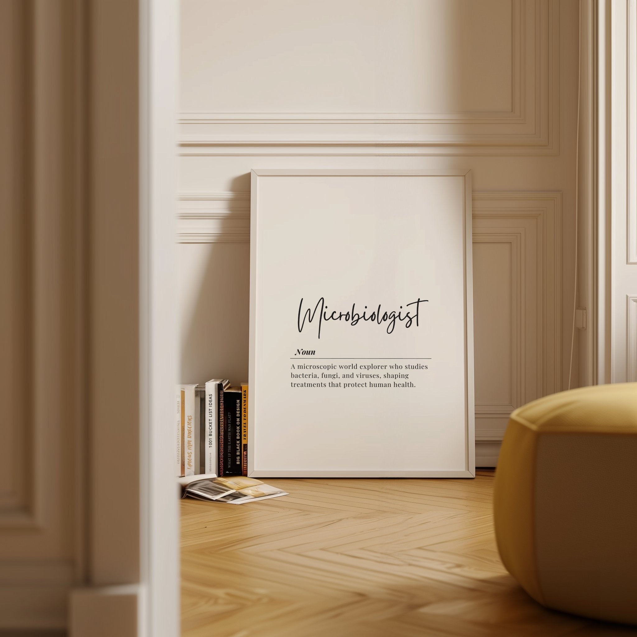 Minimalist typography print featuring 'Microbiologist' in bold cursive against white background with professional black serif definition text below, creating a clean intellectual aesthetic in a simple wooden frame.