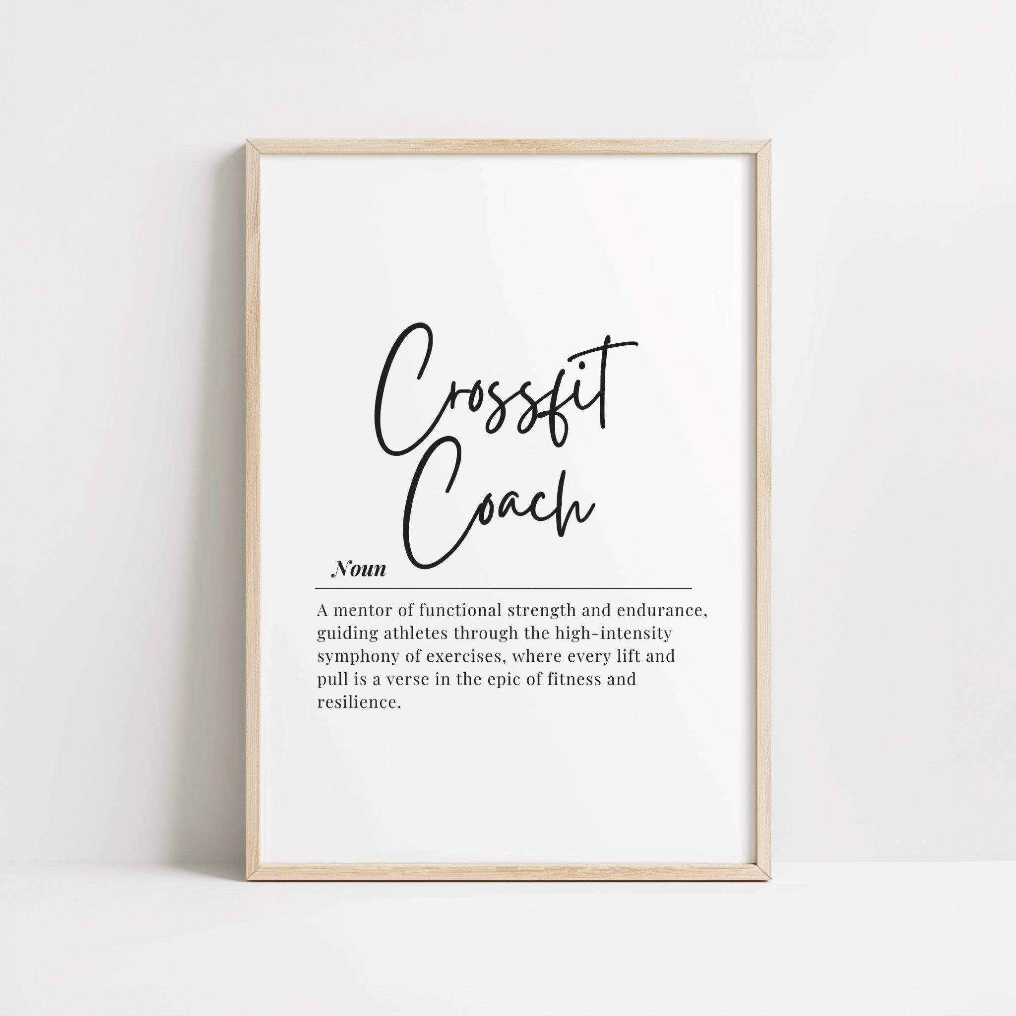 Minimalist typography print featuring 'CrossFit Coach' in bold black script against white background with inspirational definition text combining handwritten and serif fonts for professional gym spaces.