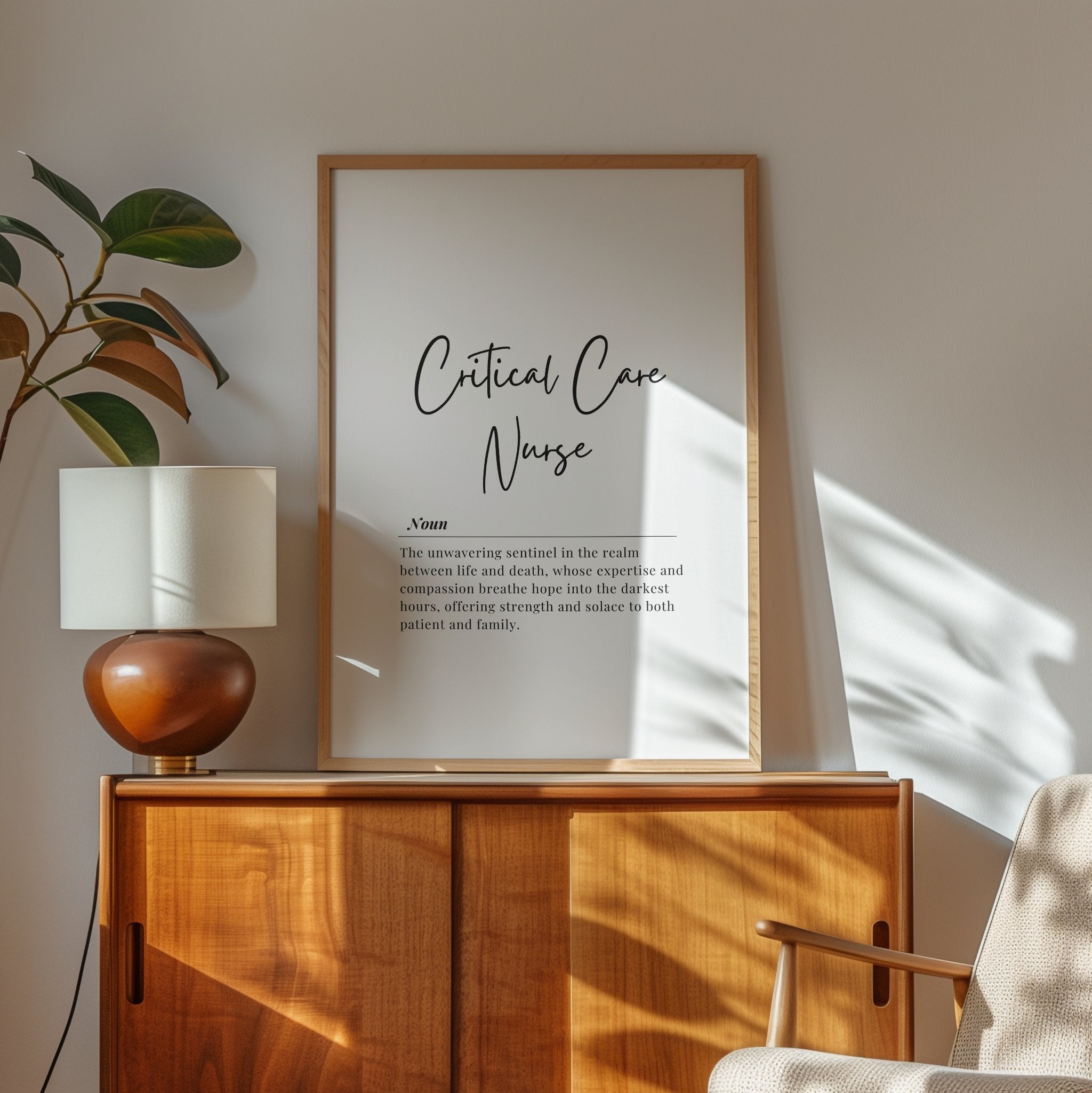 Minimalist black and white typography featuring a Critical Care Nurse definition in elegant script against crisp white background, framed in natural wood, conveying professional inspiration for healthcare environments.