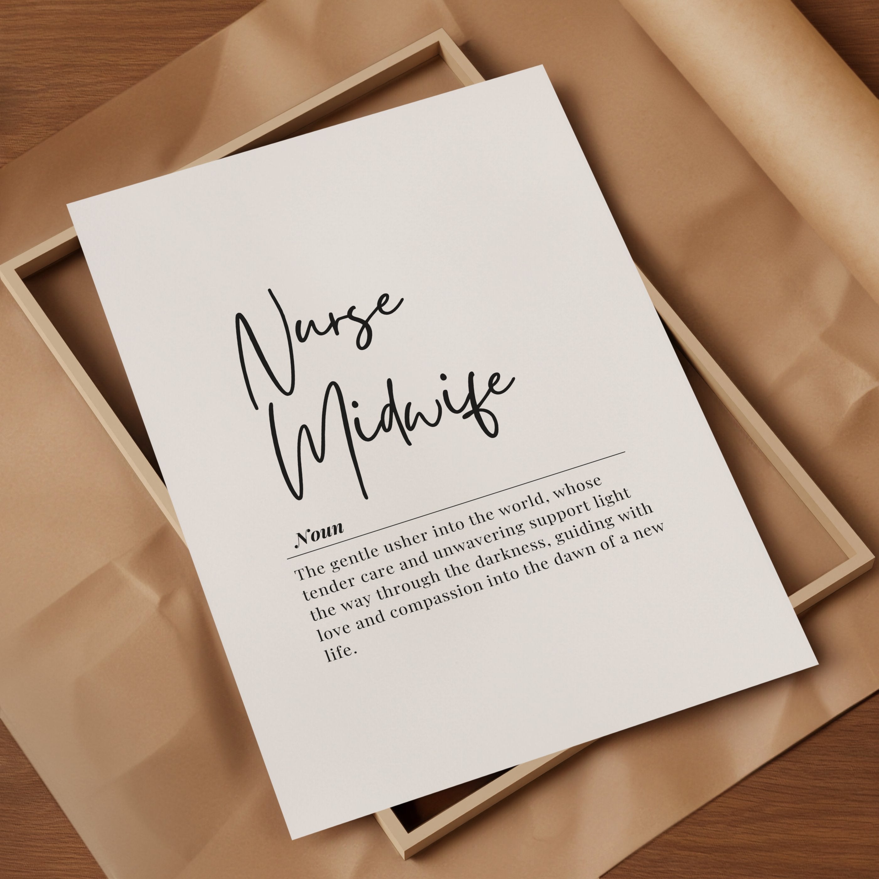 Black script font 'Nurse Midwife' with definition text below in sans-serif typography against white background, framed in natural wood, creating a sophisticated and inspirational professional display.