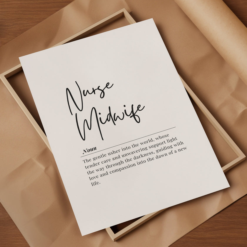 Black script font 'Nurse Midwife' with definition text below in sans-serif typography against white background, framed in natural wood, creating a sophisticated and inspirational professional display.