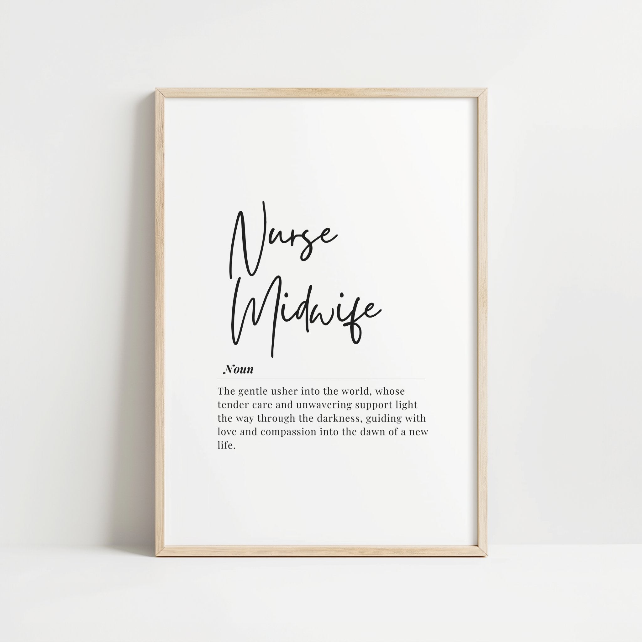 Black script font 'Nurse Midwife' with definition text below in sans-serif typography against white background, framed in natural wood, creating a sophisticated and inspirational professional display.