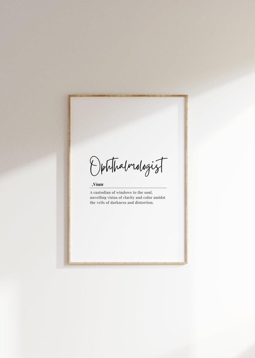 Minimalist ophthalmologist definition print with elegant typography, featuring black script against white background in a natural wood frame, conveying professional clarity and sophisticated aesthetic for medical spaces.