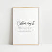 Minimalist ophthalmologist definition print with elegant typography, featuring black script against white background in a natural wood frame, conveying professional clarity and sophisticated aesthetic for medical spaces.