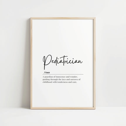 Minimalist black typography on white background displaying 'Pediatrician' definition with elegant script, framed in clean wood, perfect for pediatric offices and waiting rooms.