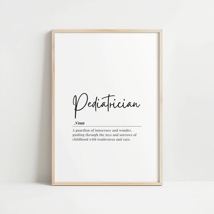 Minimalist black typography on white background displaying 'Pediatrician' definition with elegant script, framed in clean wood, perfect for pediatric offices and waiting rooms.