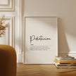 Minimalist black typography on white background displaying 'Pediatrician' definition with elegant script, framed in clean wood, perfect for pediatric offices and waiting rooms.