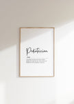 Minimalist black typography on white background displaying 'Pediatrician' definition with elegant script, framed in clean wood, perfect for pediatric offices and waiting rooms.