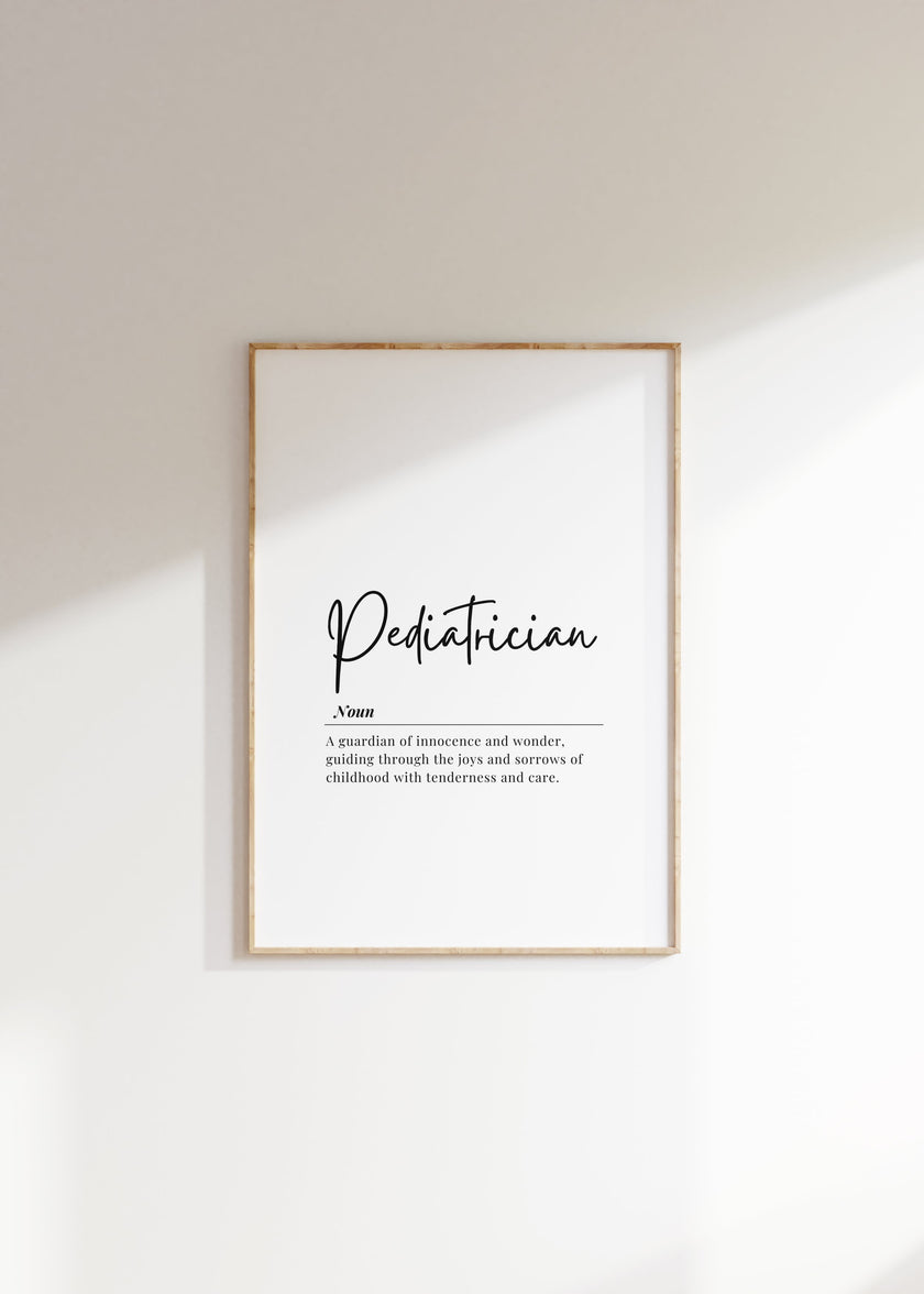 Minimalist black typography on white background displaying 'Pediatrician' definition with elegant script, framed in clean wood, perfect for pediatric offices and waiting rooms.