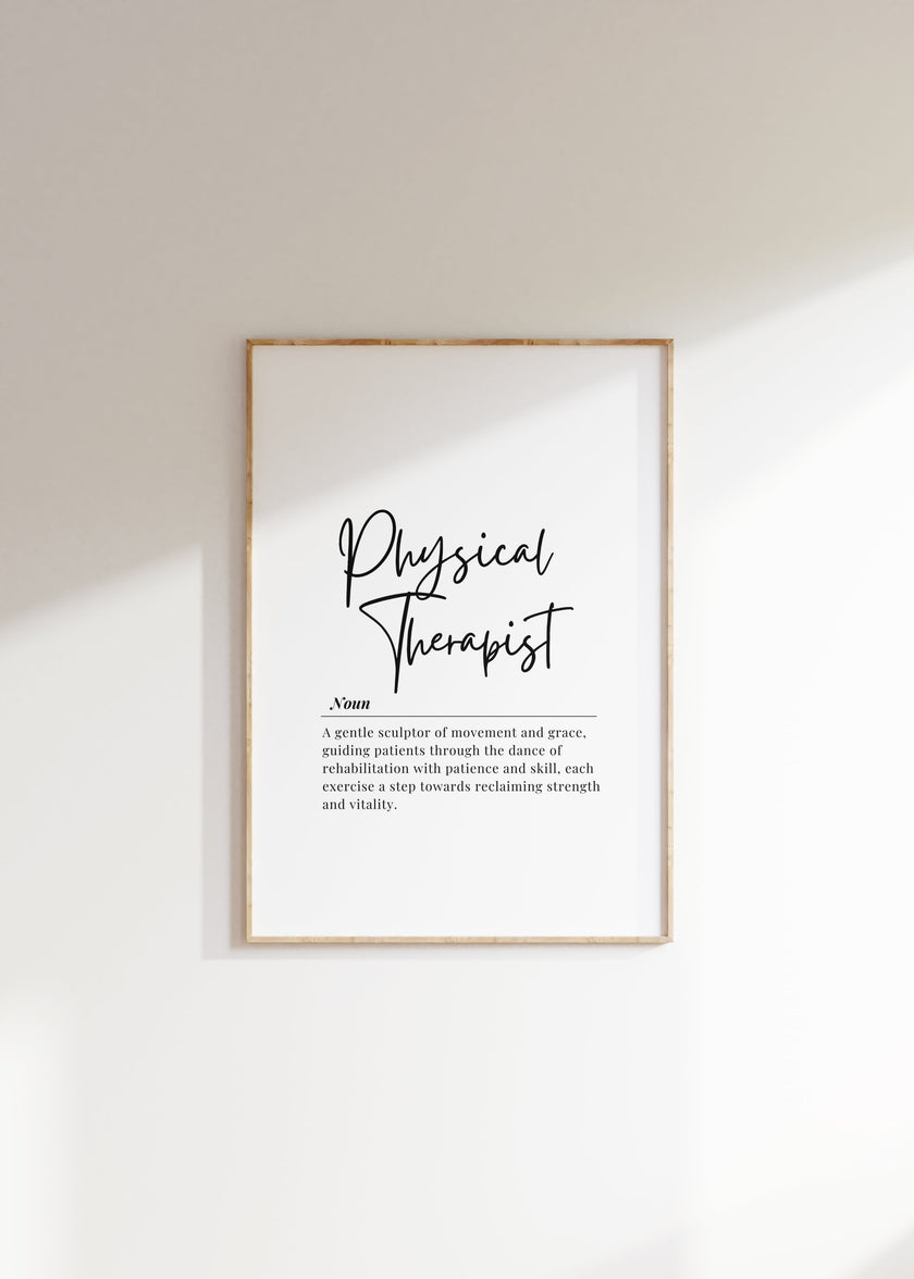 Minimalist black and white physical therapist definition print with bold script title and serif font text, showcasing professional typography against clean white background in natural wood frame.