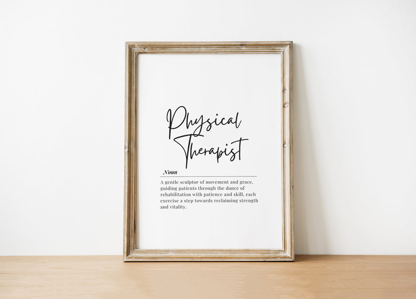 Minimalist black and white physical therapist definition print with bold script title and serif font text, showcasing professional typography against clean white background in natural wood frame.