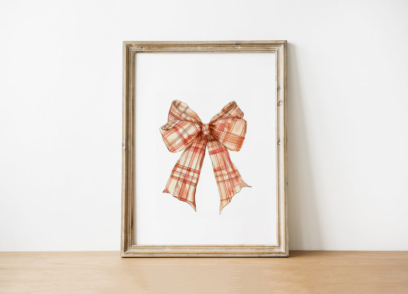 Vintage plaid bow in warm terracotta and cream tones against a white background, featuring intricate pattern detail with rustic charm perfect for farmhouse-inspired spaces.