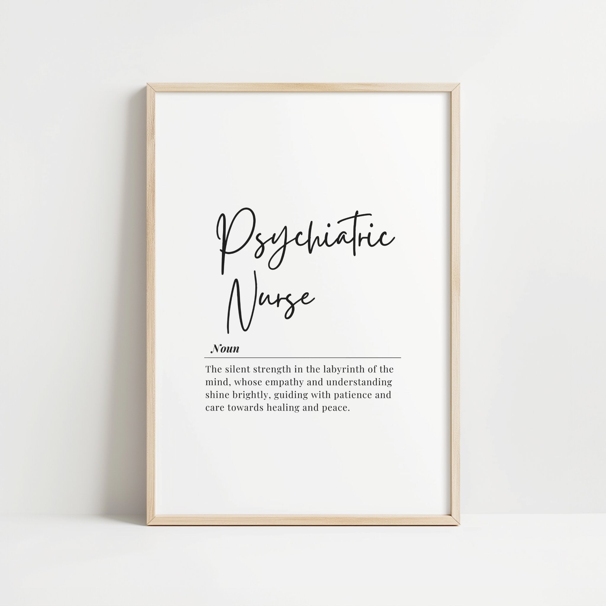 Elegant black script 'Psychiatric Nurse' with definition against white background, framed in wood, conveying empathy and healing through sophisticated typography and clean design.