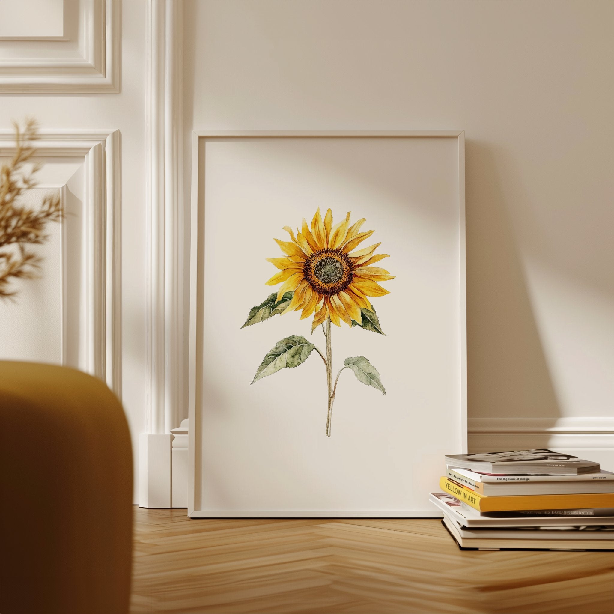 Watercolor sunflower in vibrant golden-yellow with delicate green leaves against a clean white background, displayed in a rustic wooden frame creating a minimalist, calming aesthetic.